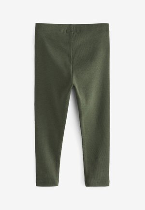 Grønne ribstrikkede leggings med elastisk taljebånd og tætsiddende design. Fremstillet af et blødt materiale med en glat tekstur og uden yderligere detaljer.