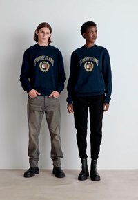 Tommy Jeans BADGE UNISEX - Flisinė striukė - dark night navy