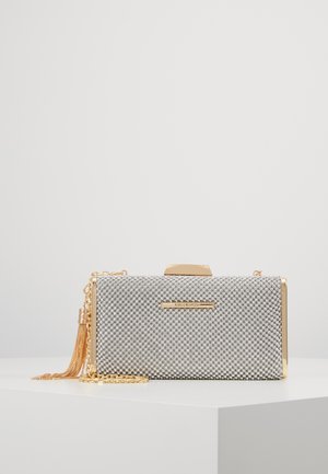 Silver textured rectangular clutch with gold trim, gold chain strap, tassel detail, and metallic clasp on a white surface.