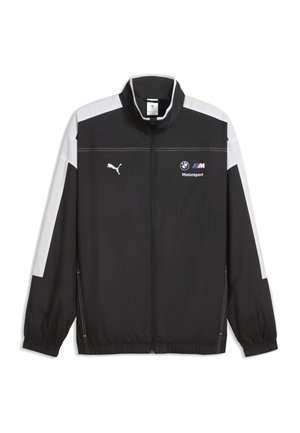 Zwart-wit jack met lange mouwen en rits, met Puma-logo op de linkerborst en BMW Motorsport-logo op de rechterborst.