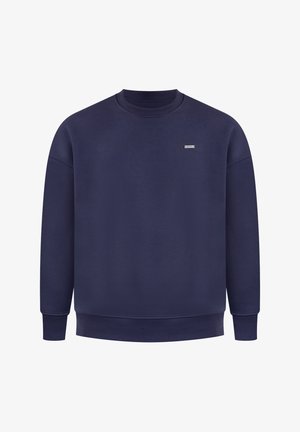 Navy blue sweatshirt made of soft cotton. Features a crew neck, ribbed cuffs, and a small logo on the chest. Simple, unadorned design.