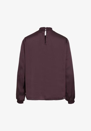 Blouse mauve à manches longues en tissu doux, dotée d'une ouverture en forme de clé au dos et de poignets froncés pour un ajustement structuré aux poignets.