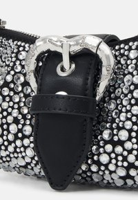 Black leather bag adorned with various-sized clear rhinestones, featuring a metallic buckle detail and a textured finish.