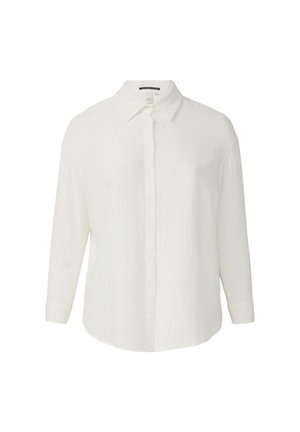 Camicia bianca con bottoni, realizzata in tessuto testurizzato, con colletto morbido e maniche lunghe. Presenta una vestibilità rilassata e un orlo curvo.