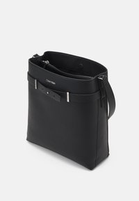 Calvin Klein CODE HOBO - Handtasche - black
