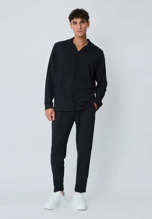 ENSEMBLE UNI - Pantalon de survêtement - noir