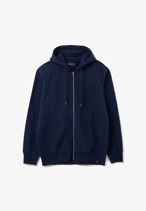 Felpa con zip di colore blu navy in cotone, dotata di tasca a marsupio, polsini a costine e una lettera "P" ricamata sul petto.