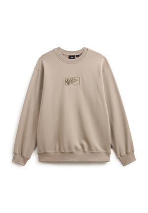 Beige sweatshirtt med ribbad rundhals och ärmar. Har en texturerad Vans-logotyp patch centrerad på bröstet. Tillverkad av mjukt tyg.