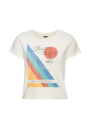 White cropped t-shirt with retro colored stripes, a red sun, a sailboat sketch, and text "Saint Tropez" and "Côte d'Azur, France."