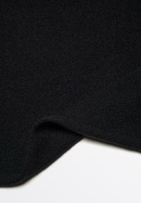 Black fabric with a soft, textured surface. The edge is gently curved, showing a smooth finish.