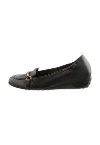 Black leather flat shoe with a rounded toe, decorative gold hardware, and a flexible rubber sole. Features a smooth texture and slip-on design.