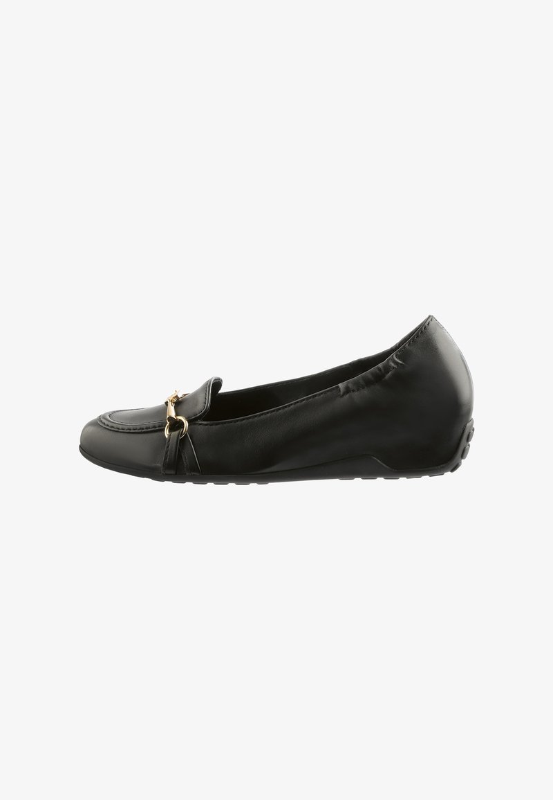 Black leather flat shoe with a rounded toe, decorative gold hardware, and a flexible rubber sole. Features a smooth texture and slip-on design.