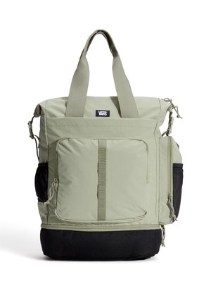 Grøn stofindkøbstaske med to håndtag og en sort bund. Har flere lommer, lynlåse og et logo-mærke på fronten.