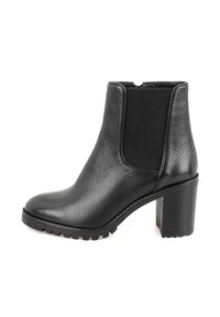 Bottine en cuir noir avec un panneau en néoprène texturé, bout rond, talon bloc épais et semelle en caoutchouc à motif.