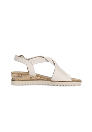 Beige open-toe sandal with twisted leather straps, cork wedge heel, and adjustable back strap with buckle closure.