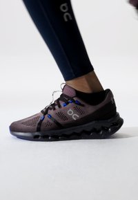 On CLOUDSURFER - Road running shoes - black