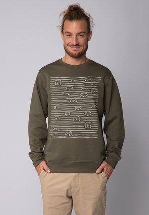 Olive green sweatshirt with long sleeves featuring a white line drawing pattern of dogs across the chest. Soft, cotton blend fabric.