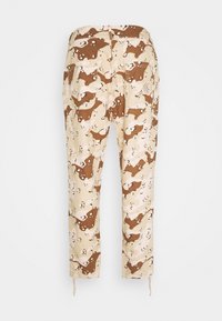 Kamouflage cargo-byxor i beige, brunt och krämfärgat. Har fickor, raka ben och dragsträngar vid bensluten. Tillverkade av mjuk, hållbar tyg.