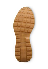 Suola in gomma con tacche profonde e quadrate per una migliore aderenza, con una sezione centrale liscia. Colore beige chiaro con finitura opaca.