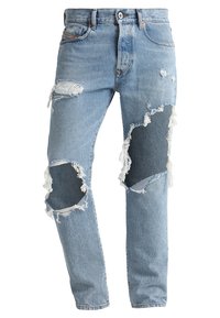 Ljusblå denimjeans med rivna knän, fransade kanter och en klassisk design med fem fickor. Raka ben med en urtvättad finish.