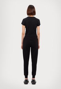 EA7 Emporio Armani TROUSER - Träningsbyxor - black
