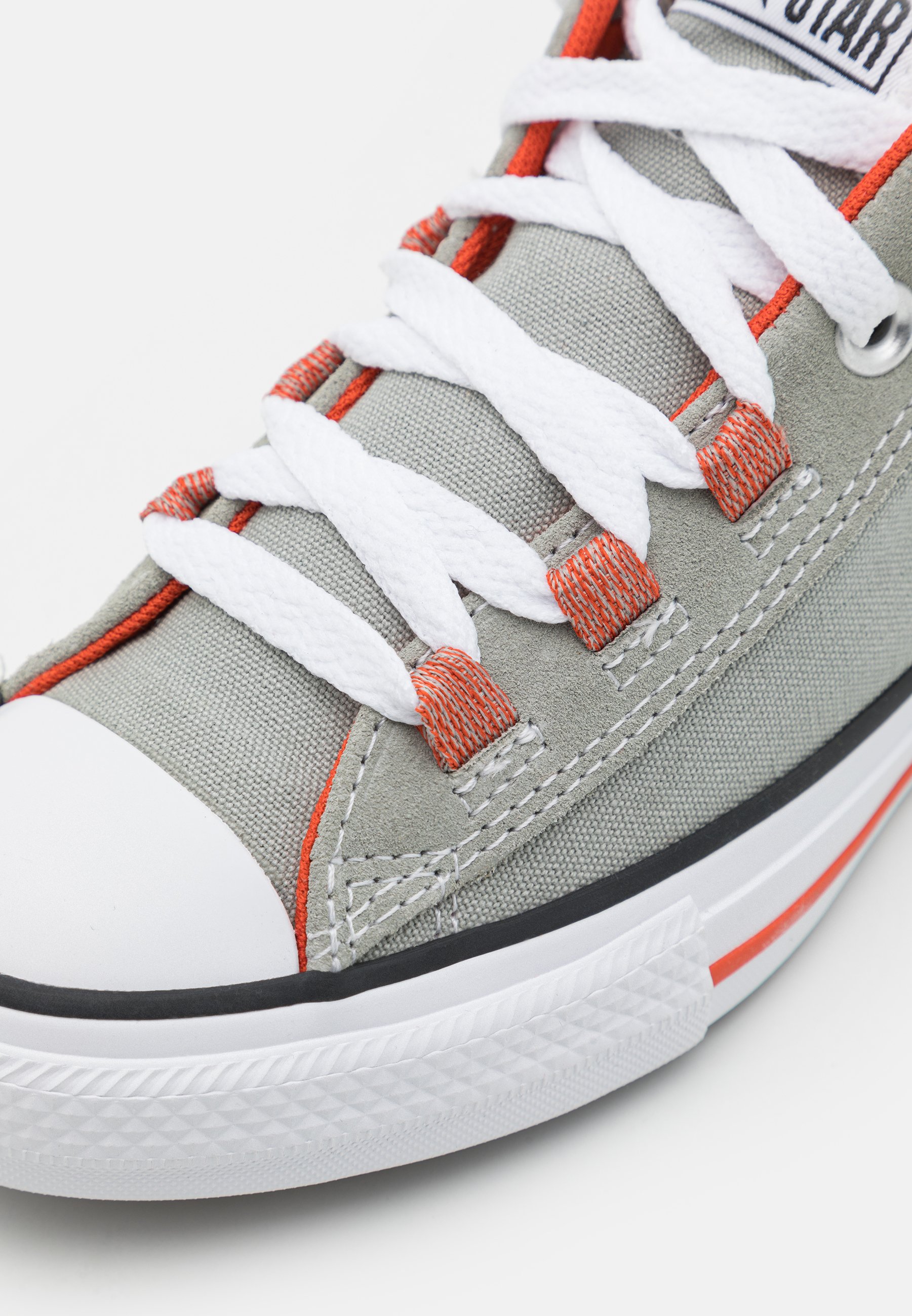 white converse orange laces