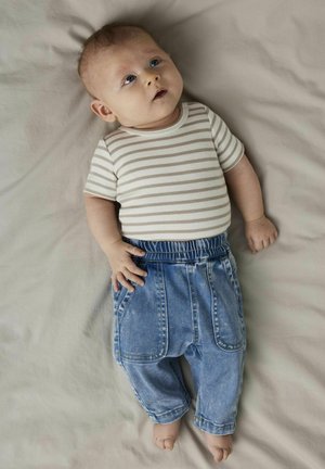 Striped short-sleeve bodysuit in beige and cream paired with blue denim pants, featuring an elastic waistband and front pockets.