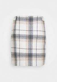 Jupette mini à carreaux présentant un motif plaid beige, blanc et gris, réalisée dans un tissu texturé avec une fermeture éclair au dos.