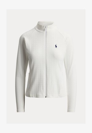 Fehér, kötött cipzáras dzseki magas nyakkal, hosszú ujjakkal, finom kötött mintával és a bal mellkason kis tengerészkék hímzett logóval.