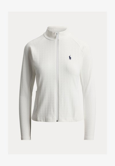 Λευκό πλεκτό μπουφάν με φερμουάρ, ψηλό γιακά, μακριά μανίκια, διακριτικό σχέδιο με πλεξούδες και μικρό κεντητό ναυτικό λογότυπο στο αριστερό στήθος.