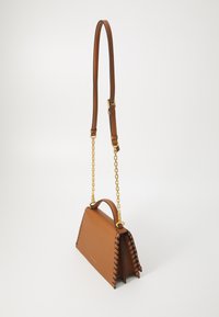 Brown leather handbag with a structured shape, gold chain accents, and contrasting stitching along the edges. Adjustable shoulder strap included.