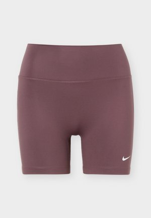 Pantaloncini sportivi viola con vita alta con un piccolo logo Nike swoosh bianco sulla parte inferiore della gamba sinistra.
