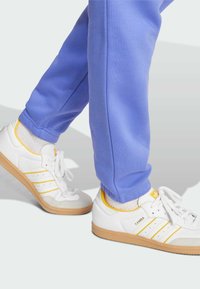 adidas Originals ESS PT - Tracksuit bottoms - semi blue