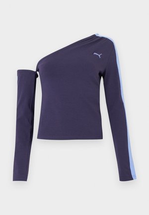 Tumesinine ühekülgne pika varrukaga pluus, mille paremal varrukal on hele sinine triip ja rinnal Puma logo.