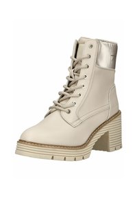 Bottine beige à lacets avec semelle épaisse rainurée et talon bloc, col rembourré et finition en cuir lisse.