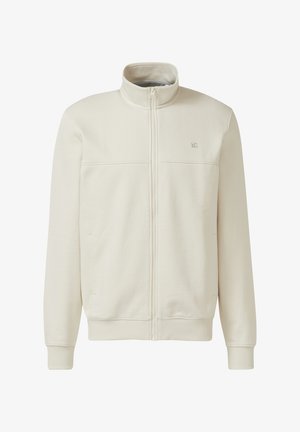 Veste intégrale à fermeture éclair de couleur blanc cassé avec col montant, poignets et ourlet côtelés, et petit logo brodé sur la partie supérieure gauche de la poitrine.