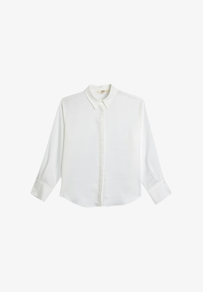 White long-sleeve shirt with a classic collar, front placket, and buttoned cuffs. Smooth, lightweight fabric with a slightly rounded hem.