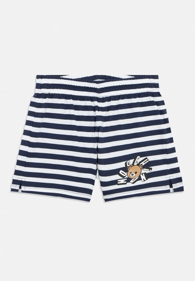 Σορτς με λευκές και ναυτικές ρίγες, φτιαγμένα από απαλό ύφασμα, με ελαστική μέση και σχέδιο καρτούν αρκουδάκι μπροστά.