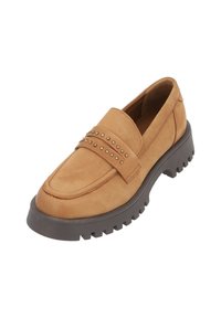 Tan leather loafer with a chunky dark gray sole. Features a strap with metallic studs and a smooth, textured upper.