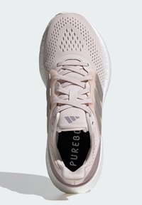 Light pink athletic shoe with mesh upper, cushioned sole, and three tone-on-tone stripes. Features a textured design and padded collar.