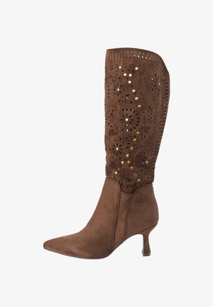 Brown suede mid-calf women's boot with pointed toe, kitten heel, and laser-cut floral patterns accented by gold studs.