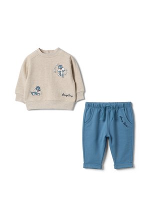 Beige langärmliges Sweatshirt für Kleinkinder mit Cartoon-Katze und blaue Hose, beide mit "Looney Tunes"-Textdetails.