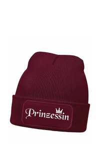 Maroon knitted beanie with a folded cuff featuring a rectangular patch that displays the word "Prinzessin" in white cursive text and a crown icon.