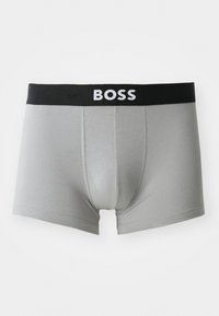 Szürke pamut boxer alsók fekete gumis derékkal, rajta fehér "BOSS" logóval. Simaság jellemzi és illeszkedő fazonú.