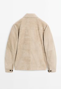 Beige suede jacket with a flat collar, long sleeves, and buttoned cuffs. Features a smooth texture and simple, clean lines.