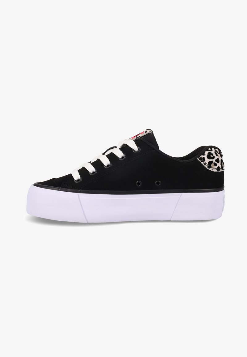 Black sneaker with white laces, a thick white sole, and a leopard print accent at the back. Smooth material and low-top design.