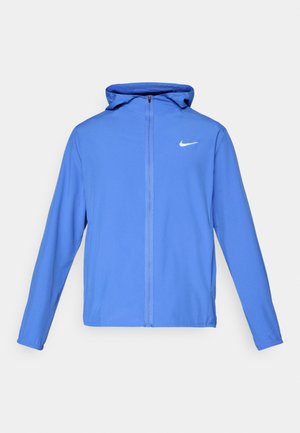 Blue athletic jacket with a hood, made from lightweight fabric. Features a white Nike logo on the left chest and a full front zipper.