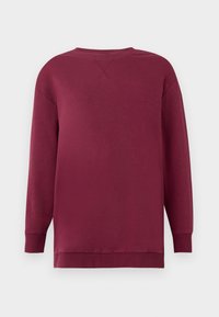 Sweat-shirt manches longues col rond en bordeaux uni avec poignets et ourlet côtelés, présenté sur un fond clair uni.