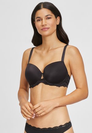 Zwarte push-up bh met kantafwerking, voorgevormde cups, verstelbare schouderbanden en een klein decoratief strikje in het midden. Glad stofmateriaal.