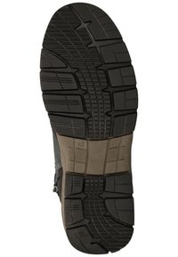 Semelle en caoutchouc noir avec des motifs de texture et des rainures pour une meilleure traction. Taille marquée 42.